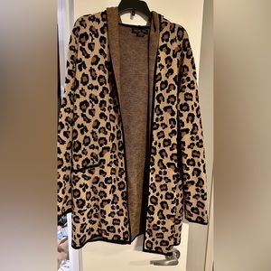 Leopard print cardigan with open front and hood.